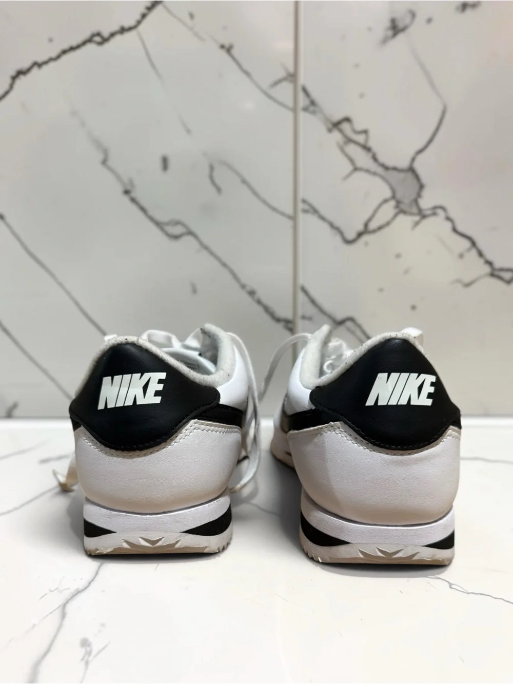 Nike Men’s White Leather Sneakers with Black Swoosh